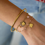 Bracelet with clover and bead charms