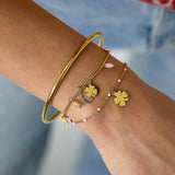 Bracelet with clover and bead charms