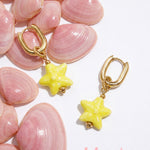 Squoval earrings with colored star pendant