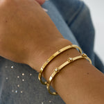 Bangle with floral detail and rhinestone
