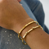 Bangle with floral detail and rhinestone