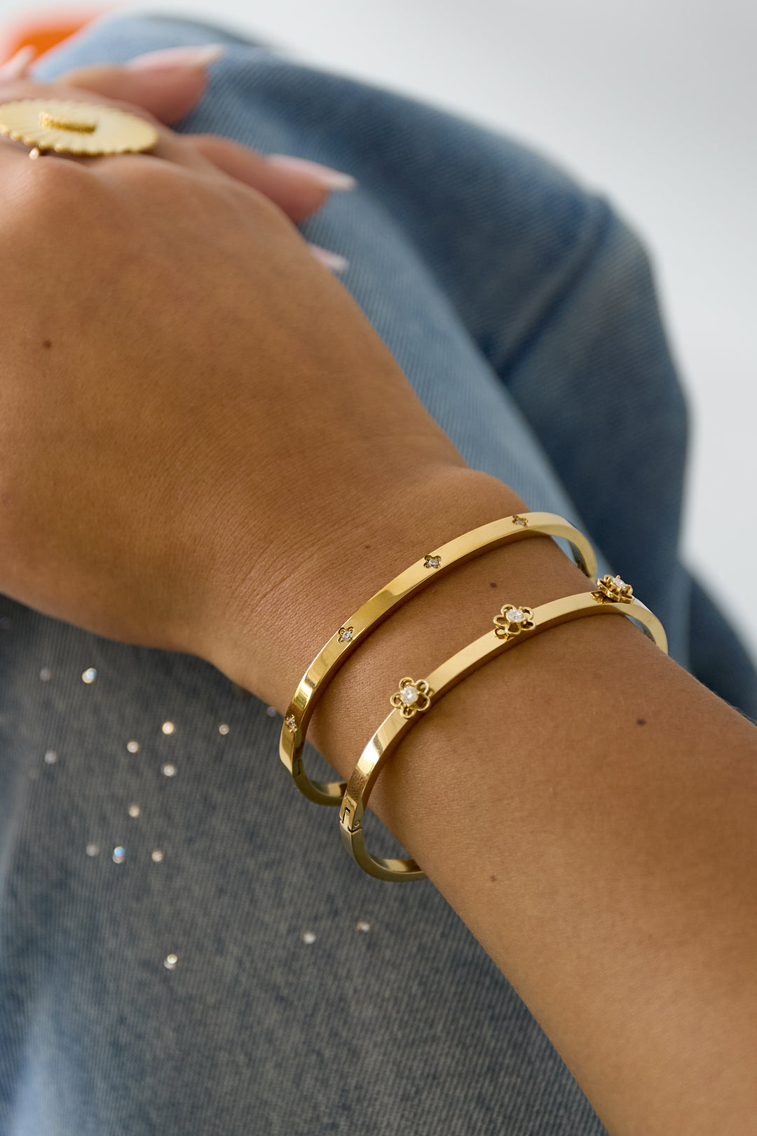 Bangle with floral detail and rhinestone