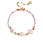 Bracelet with tortoise and shell beads and rope motif