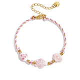 Bracelet with tortoise and shell beads and rope motif