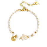 Bracelet with rope-pattern beads, starfish, and shell