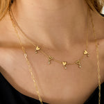 Necklace with alternating hearts and dangling stones