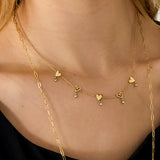 Necklace with alternating hearts and dangling stones