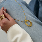 Long necklace with oval striped pendant