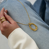 Long necklace with oval striped pendant