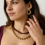 Linked necklace with gold and colored beads