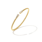 Symmetrically dotted bangle with detailed ends