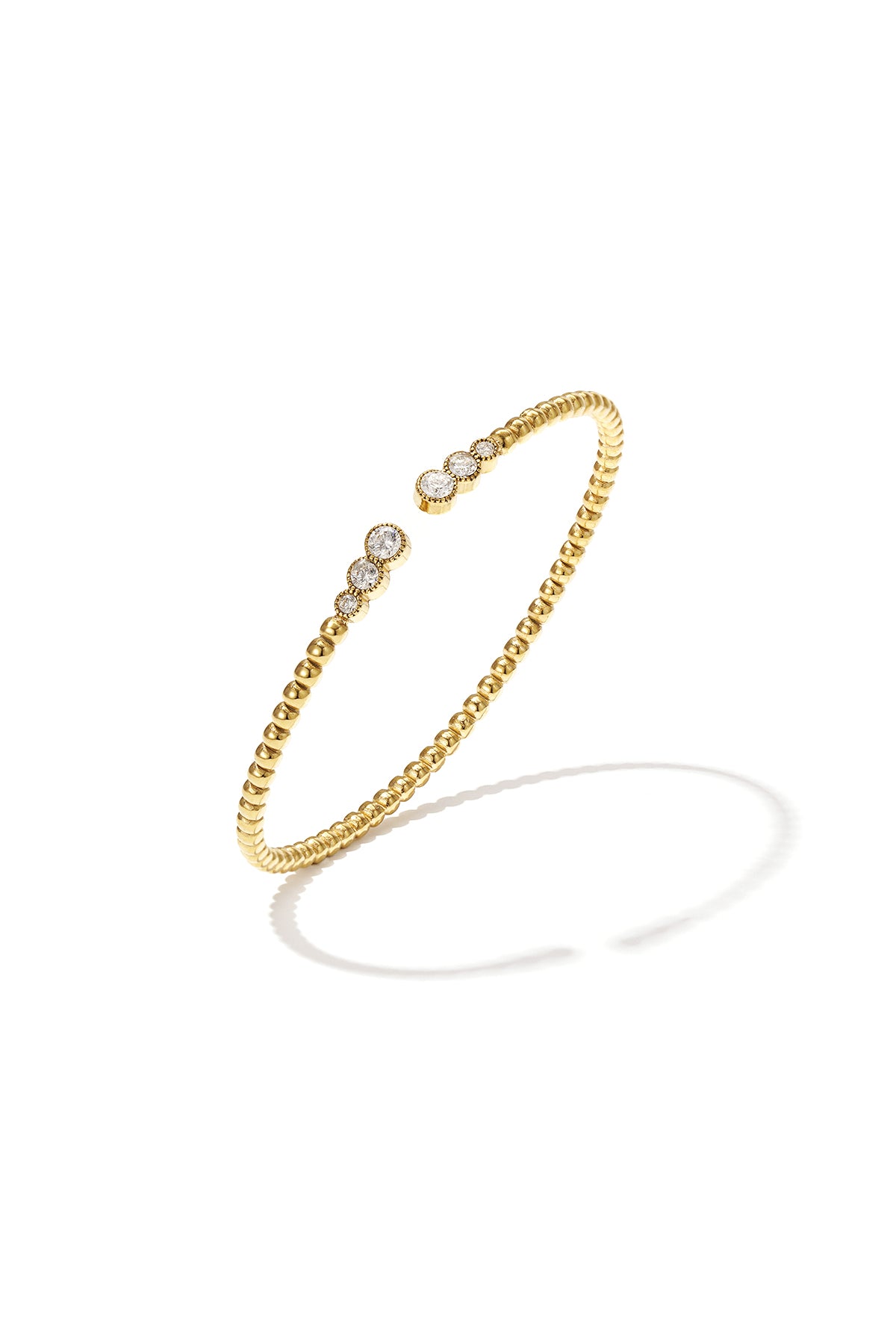 Symmetrically dotted bangle with detailed ends