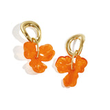 Round earrings with hanging flower