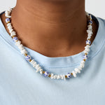 Necklaces with stone beads and white beads with blue flowers