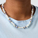 Necklaces with stone beads and white beads with blue flowers