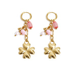 Small hoop earrings with hanging clover, beads and leaves