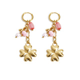 Small hoop earrings with hanging clover, beads and leaves