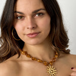 Bead necklace with sun charm