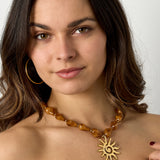 Bead necklace with sun charm