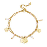 Bracelet with clover and bead charms