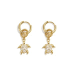 Earrings with a dangling turtle