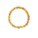 Beaded bracelet with heart-shaped centerpiece