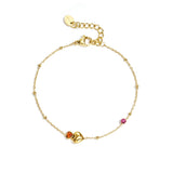 Bracelet with hearts, colored stones, and dots