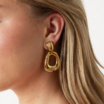 Teardrop-shaped statement earrings with design