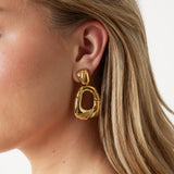 Teardrop-shaped statement earrings with design
