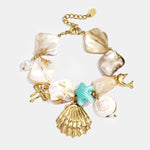Bracelet with shells, sea charms, gold and blue beads