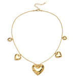 Necklace with beads and different shaped hearts