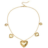 Necklace with beads and different shaped hearts