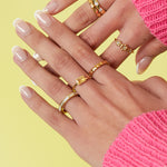Angular ring with stones and mother-of-pearl detail