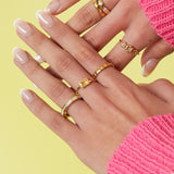 Angular ring with stones and mother-of-pearl detail