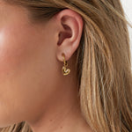 Earrings with a detailed dangling heart