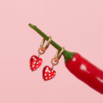 Earrings with dangling hearts with dots