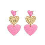 Statement earrings with glitter hearts