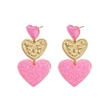 Statement earrings with glitter hearts
