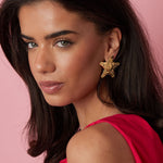 Dented star earrings