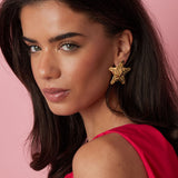 Dented star earrings