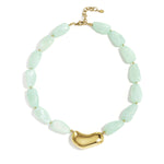 Necklace with asymmetric statement bead