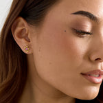 Flower-like shape stud earrings with stone detail
