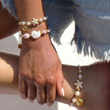 Rope bracelet with shell and floral design beads