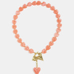 Bead necklace with hanging heart charms