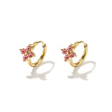 Small hoop earrings with clover-shaped stones