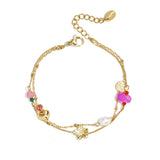 Charm bracelet with heart, flower, pearl and beads