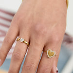 Ring with alternating hearts and cubic zirconia