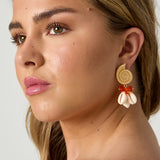 Earrings with shell-shaped pendants and beads