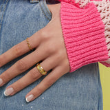 Ring with stones in clover pattern