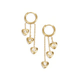 Earrings with dangling hearts at different heights